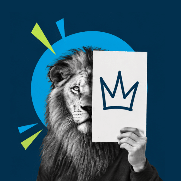 Person with a lion mask holds a white poster showing a blue crown, against a dark blue backdrop.